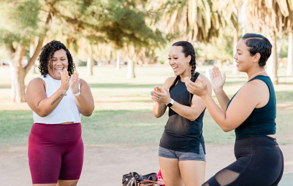 Women having a good time in the park working out