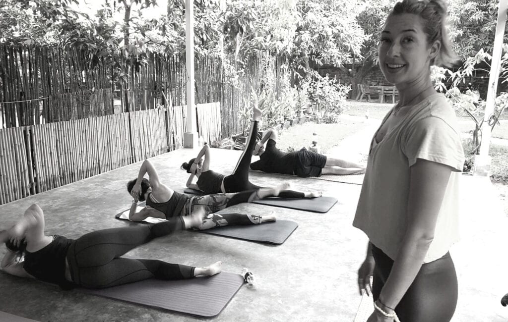 Lesley Logan, Pilates business/studio owner teaching group Pilates exercises in Cambodia