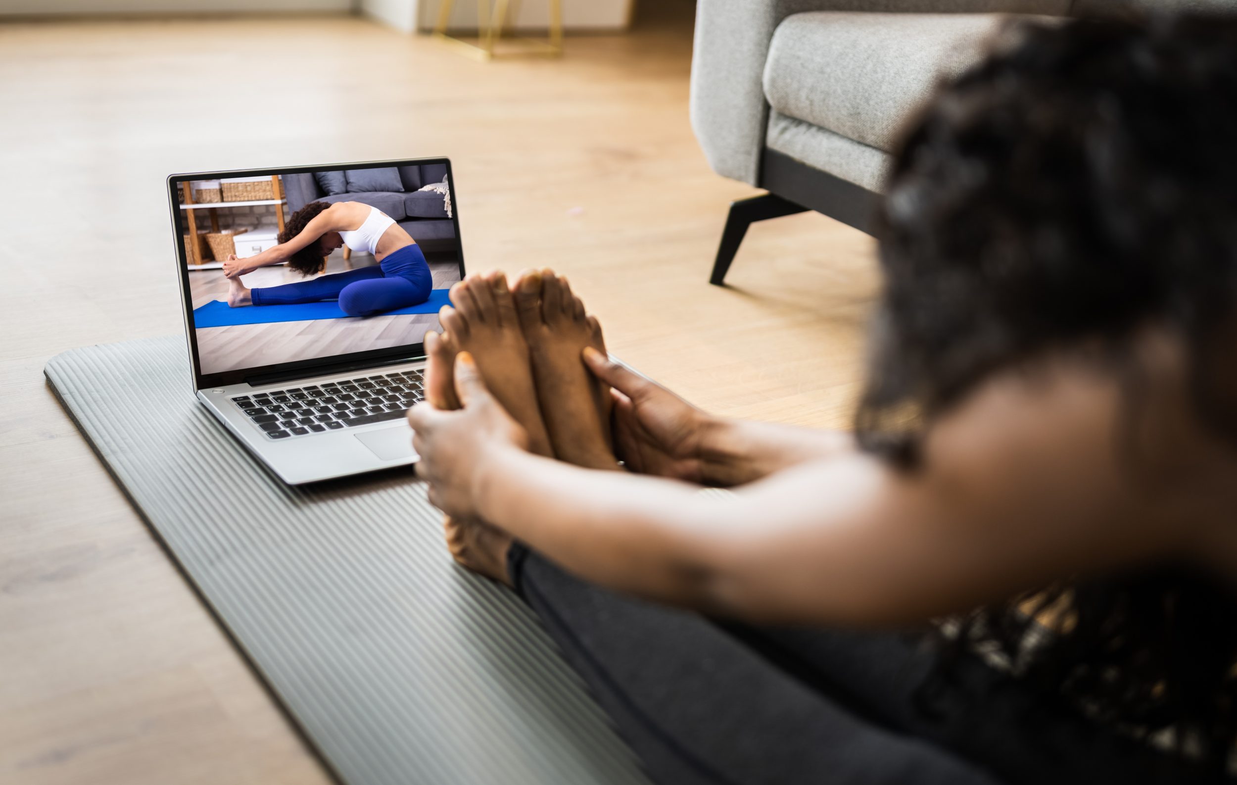 Fitness woman watching videos while doing her exercise